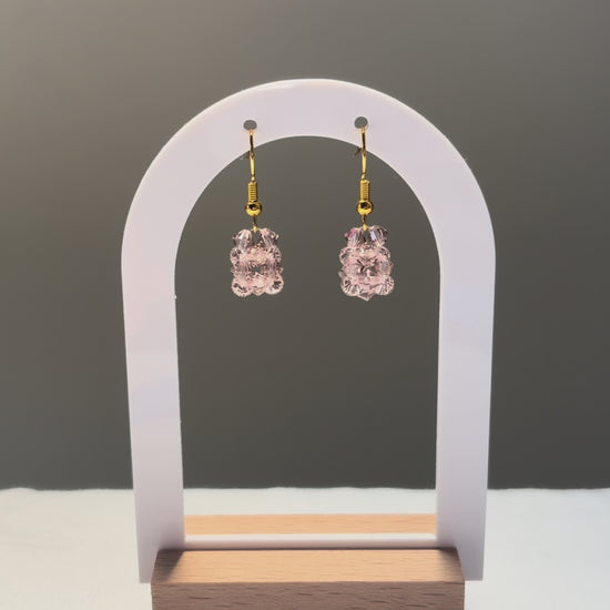 A video of the Solid Earrings Rose dangling in the sunlight, sparkling beautifully. 