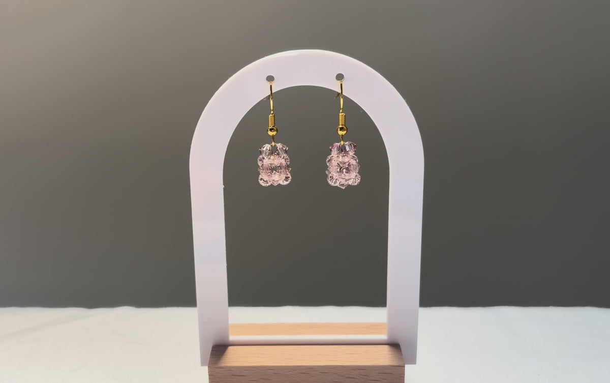 A video of the Solid Earrings Rose dangling in the sunlight, sparkling beautifully. 