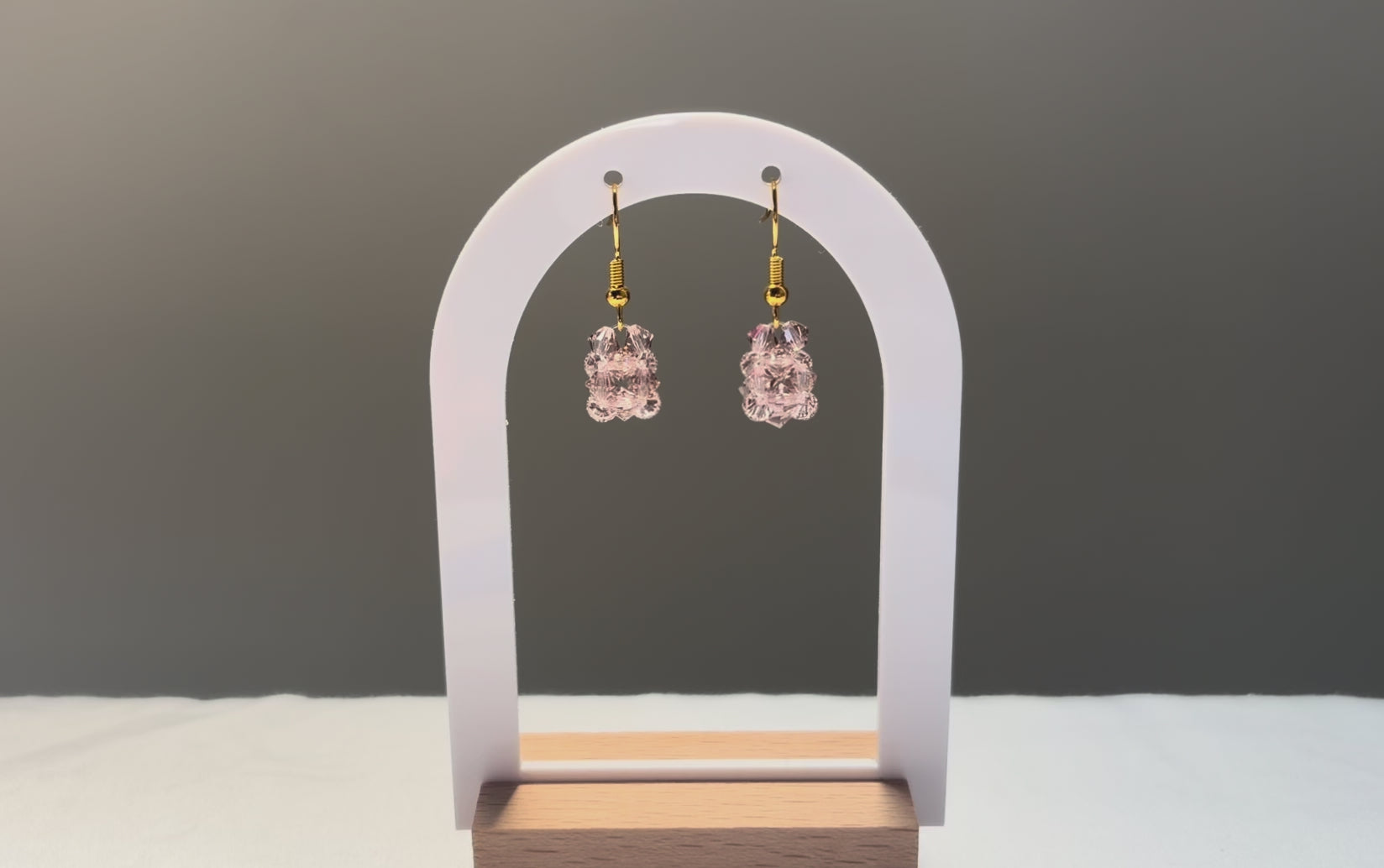 A video of the Solid Earrings Rose dangling in the sunlight, sparkling beautifully. 