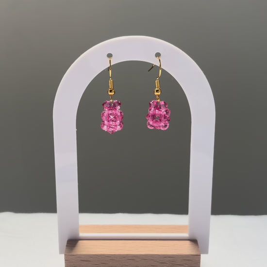 A video of the Solid Earrings Kylie Mariposa dangling in the sunlight, sparkling beautifully. 