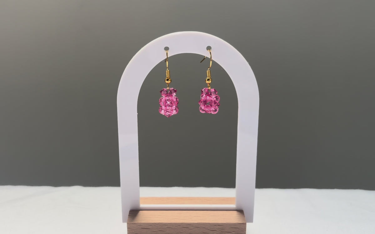 A video of the Solid Earrings Kylie Mariposa dangling in the sunlight, sparkling beautifully. 
