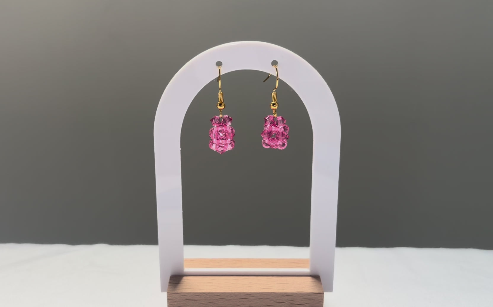 A video of the Solid Earrings Kylie Mariposa dangling in the sunlight, sparkling beautifully. 