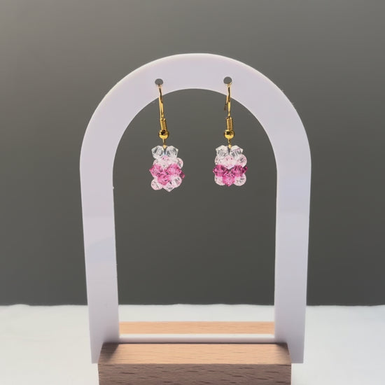 A video of the V Earrings Kylie Mariposa dangling in the sunlight, sparkling beautifully. 
