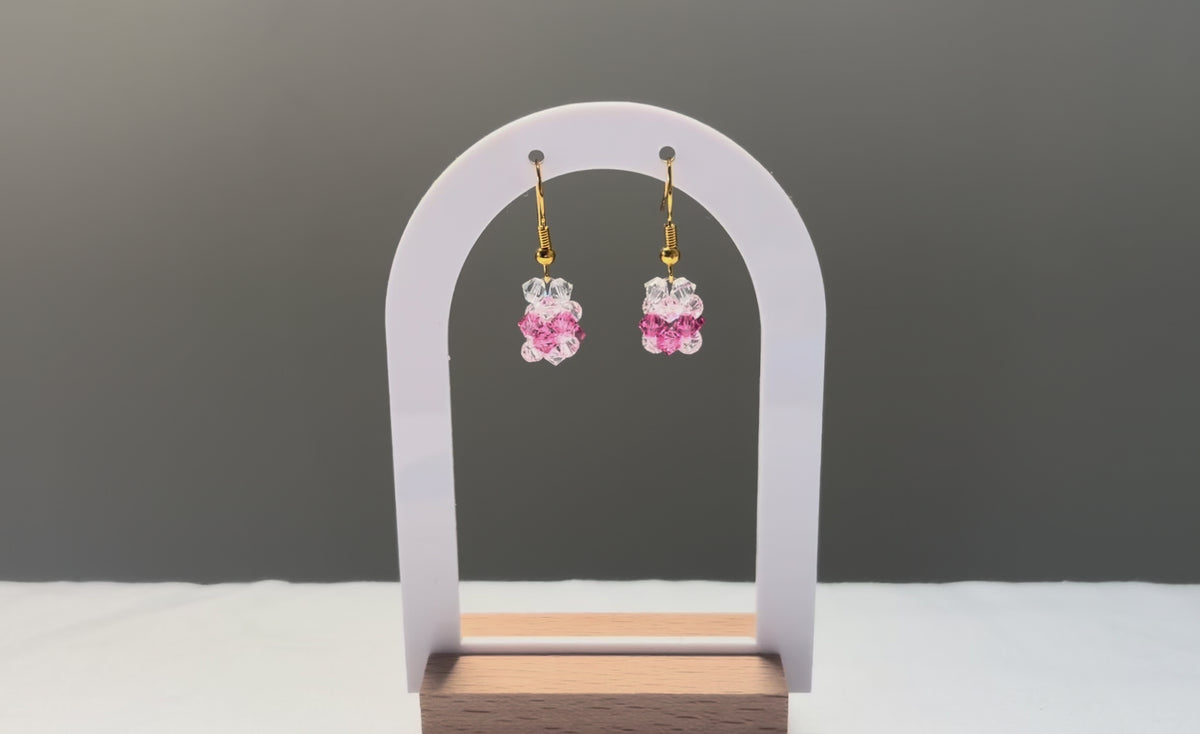 A video of the V Earrings Kylie Mariposa dangling in the sunlight, sparkling beautifully. 
