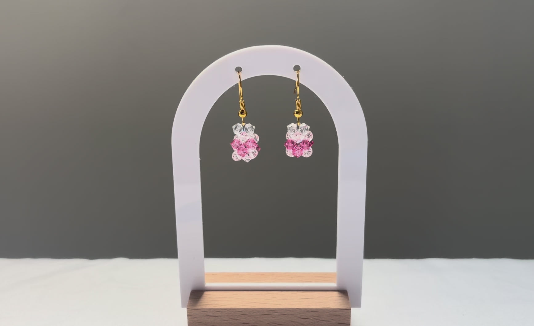 A video of the V Earrings Kylie Mariposa dangling in the sunlight, sparkling beautifully. 