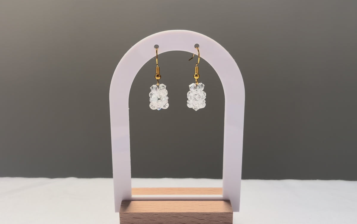 A video of the Solid Earrings Iced dangling in the sunlight, sparkling beautifully. 