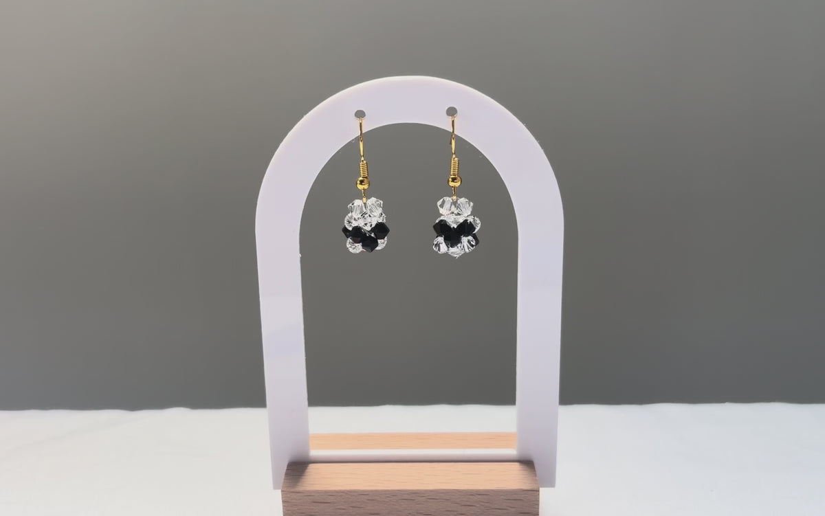 A video of the V Earrings Bossanova dangling in the sunlight, sparkling beautifully. 