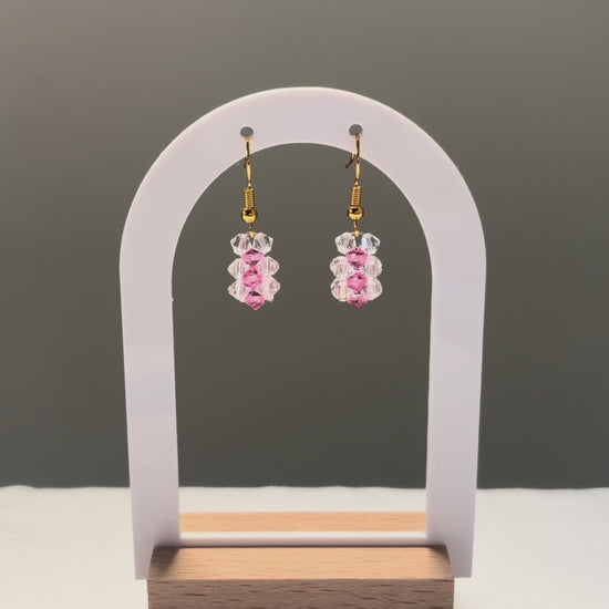A video of the Striped Earrings Kylie Mariposa dangling in the sunlight, sparkling beautifully. 