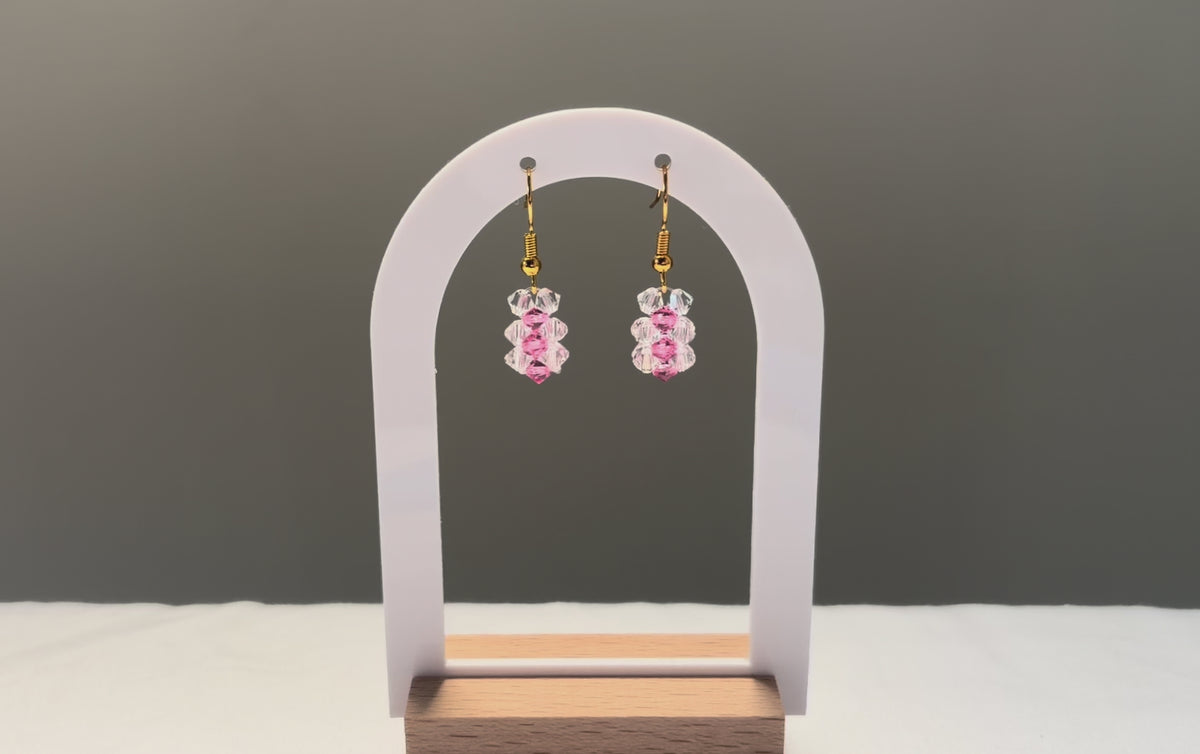 A video of the Striped Earrings Kylie Mariposa dangling in the sunlight, sparkling beautifully. 